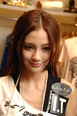 Hong Kong singer and actress Angelababy is seen during a press conference to promote her photo album Paradise in Hong Kong, China, 28 June 2010. clipart