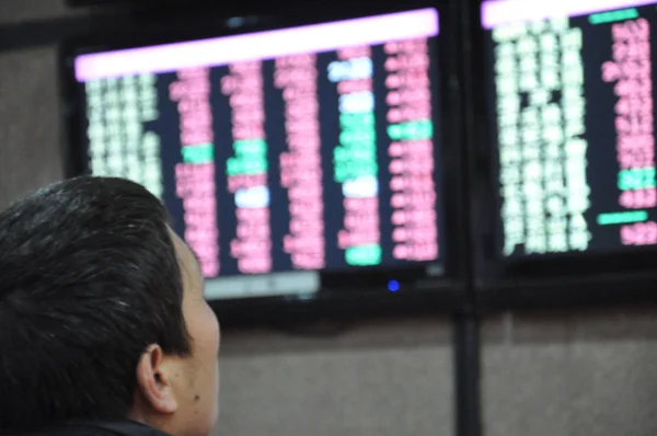 Chinese Investor Looks Share Prices Red Price Rising Stock Brokerage — Stock Photo, Image