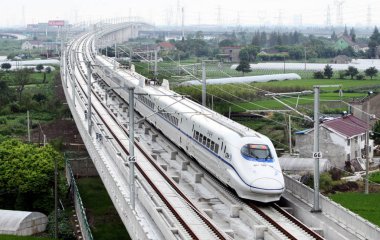 A CRH (China Railway High-speed) train runs on the Shanghai-Hangzhou High-speed Railway during a test run in Jiashan county, Jiaxing city, east Chinas Zhejiang province, 1 September 2010 clipart