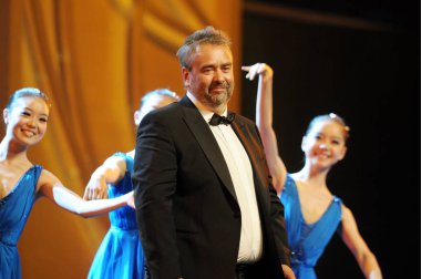 French film director Luc Besson poses after being awarded the Outstanding Lifetime Achievement to Film Art at the opening ceremony of the 13th Shanghai International Film Festival in Shanghai, China, 12 June 2010 clipart