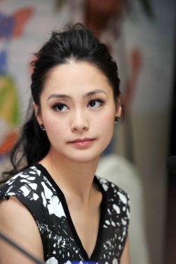 Hong Kong singer and actress Gillian Chung (Chung Yan-tung) is seen during a press conference for the movie, The Fantastic Water Babes, in Wuhan city, central Chinas Hubei province, 28 June 2010. clipart