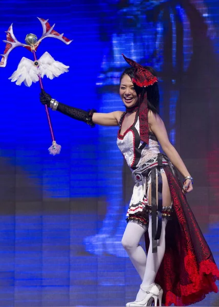 Chinese contestants dressed in the costumes of the figures in the  electronic video game KOF (The King Of Fighters) perform in the final of the  10th Su Stock Photo - Alamy