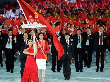 The Chinese delegation attends the opening ceremony of the 16th Asian Games in Guangzhou city, south Chinas Guangdong province, 12 November 2010 clipart