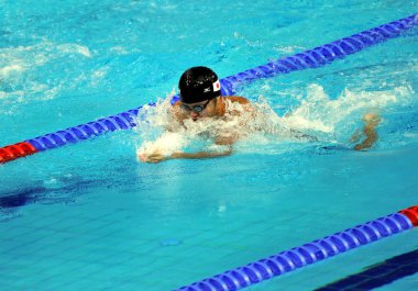 Kosuke Kitajima of Japan competes in the mens 50m breaststroke final at the 16th Asian Games in Guangzhou city, south Chinas Guangdong province, 14 November 2010. clipart