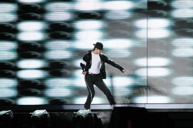 Michael Jackson imitator Suleman Mirza of British dance duo Signature, runner-up of Britains Got Talent 2008, performs during the final of Chinas Got Talent 2010 at the Shanghai Stadium in Shanghai, China, 10 October 2010 clipart