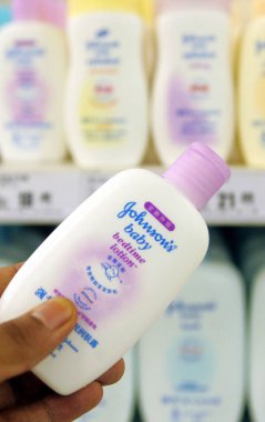 Bottles of Johnsons baby lotion manufactured by Johnson & Johnson are seen for sale at a supermarket in Shanghai, China, 4 August 2008 clipart