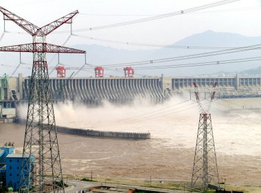 Water is seen sluiced through the Three Gorges Dam on the Yangtze River in Yichang city, central Chinas Hubei province, 31 July 2007. clipart