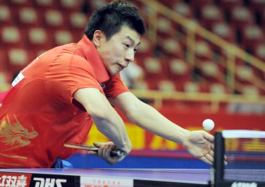 Chinas Ma Long competes against Tang Peng of Hong Kong, unseen, at the mens quarter-final of the Asian Cup Table Tennis Tournament 2009 in Hangzhou city, east Chinas Zhejiang province, Tuesday, 19 May 2009 clipart