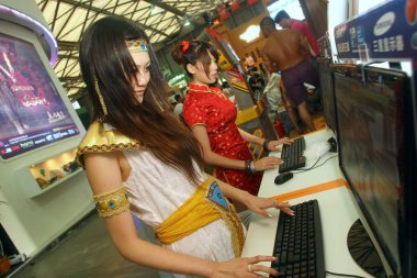 Chinese COSPLAY performers play online games at the 7th China Digital Entertainment Expo and Conference (Chinajoy), in Shanghai, China, Thursday, July 23, 2009 clipart