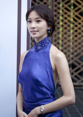 Taiwanese model and actress Lin Chi-ling poses during a commercial campaign to promote watches of Swiss watchmaker Longine in Hangzhou city, east Chinas Zhejiang province, 7 November 2010. clipart