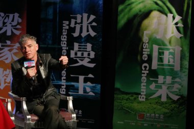 Australian cinematographer Christopher Doyle answers questions at a press conference for the movie Ashes of Time Redux in Beijing, China, Wednesday, 25 March 2009.  clipart