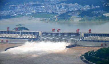 The Three Gorges Dam discharges water of the Yangtze River to lower the level in the reservoir in Yichang city, central Chinas Hubei province, Thursday, 6 August 2009 clipart