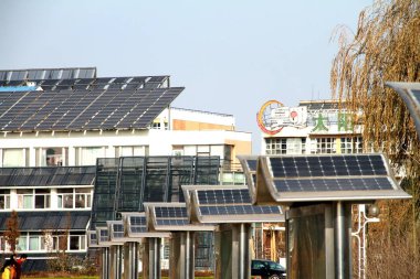 Solar showcases are seen in front of buildings equipped with solar heat pipe collectors and solar panels in the Solar Valley, developed by Himin Group, the largest solar products manufactuer in China, in Dezhou city, east Chinas Shandong province, 29 clipart