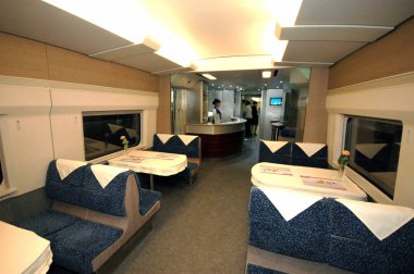 View of the restaurant of a CRH3 (China Railway High-speed 3) train leaving for Tianjin during a test run at the Beijing South Railway Station in Beijing, 31 July 2008 clipart