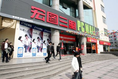 Local Chinese citizens walk past a branch of Hisap PC Mall in Shanghai, China, 17 April 2008 clipart
