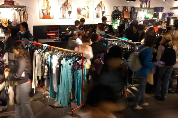 Customers are seen at an Ochirly store in Shanghai, China, 13