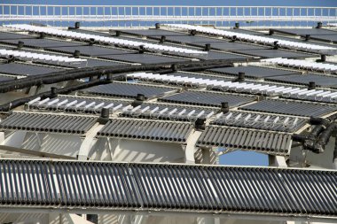 Many solar heat pipe collectors are seen installed on the rooftop of the Solar Valley Micro-E Hotel in the Solar Valley, developed by Himin Group, the largest solar products manufactuer in China, in Dezhou city, east Chinas Shandong province, 27 Nove clipart