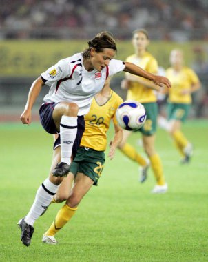 Trine Ronning of Norway, front, competes with Joanne Burgess of Australia during a Group C match of the 2007 FIFA Womens World Cup in Hangzhou, east Chinas Zhejiang province 15 September 2007. Norway drew with Australia 1-1. clipart