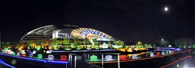 Night view of the Solar Valley Micro-E Hotel equipped with many solar heat pipe collectors and solar panels in the Solar Valley, developed by Himin Group, the largest solar products manufactuer in China, in Dezhou city, east Chinas Shandong p clipart