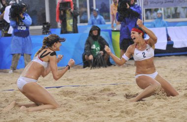 Kerri Walsh (L) and Misty May of USA celebrate after winning the gold of womens beach volleyball, at Beijing 2008 Olympic Games, at Beijings Chaoyang Park Beach Volleyball Ground, in Beijing, August 21, 2008. clipart
