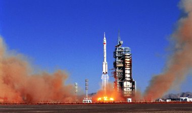 A Long March 2F (CZ-2F) rocket carrying Shenzhou V manned spacecraft blasts off at the Jiuquan Satellite Launch Center in northwest Chinas Gansu province 15 October 2003. clipart