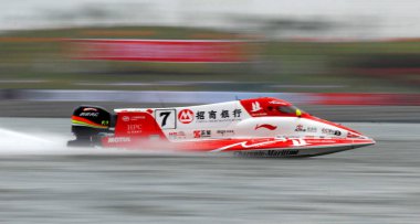 French F1 Powerboat driver Philippe Dessertenne of the China CTIC Team competes during the final of the Formula One Power Boat Shenzhen Grand Prix of the U.I.M. F1 World Championships in Shenzhen city, south Chinas Guangdong province, Sunday, 26 Octo clipart