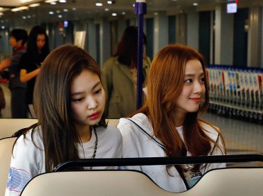 Jennie and Jisoo of South Korean girl group Blackpink are pictured after landing at the airport in Taipei, Taiwan, 2 March 2019.