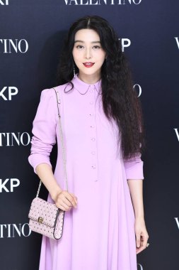Chinese actress Fan Bingbing poses at a promotional event for Valentino in Beijing, China, 9 August 2017. clipart