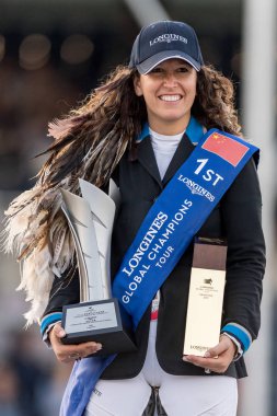 Danielle Goldstein of Israel, left, poses with her trophy after winning the Shanghai Grand Prix of the 2019 Shanghai Longines Global Champions Tour in Shanghai, China, 4 May 2019 clipart