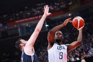 American professional basketball player who plays for the Sacramento Kings of the National Basketball Association (NBA) Harrison Barnes, right, protects the ball at the first round of Group K America vs Greece 2019 FIBA Basketball World Cup in Shenzh
