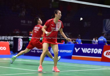 Chinese professional badminton players Zheng Siwei and Huang Yaqiong compete against Japanese professional badminton players Takuro Hoki and Wakana Nagahara at the first round of mixed doubles at VICTOR China Open 2019, in Changzhou city, east China' clipart