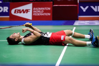 Japanese professional badminton player Kento Momota competes against Indonesian professional badminton player Anthony Sinisuka Ginting at the final of men's single of VICTOR China Open 2019, in Changzhou city, east China's Jiangsu province, 22 Septem clipart