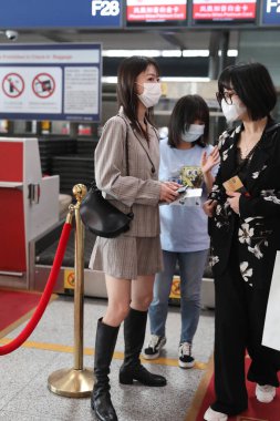 Chinese actress Wu Jinyan arrives in Beijing airport, Beijing, China, May 12, 2020. clipart