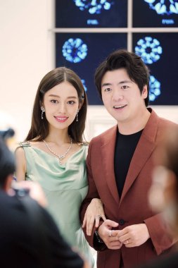 Renowned Chinese pianist Lang Lang and his wife, German-Korean pianist Gina Alice Redlinger, attend an activity in Shanghai, China, 28 August 2020. clipart