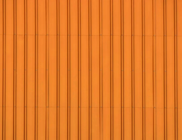 Beautiful background stainless steel corrugated sheet closeup with brushed textures in orange color — Stock Photo, Image