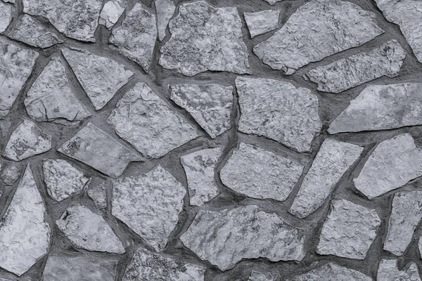Старая стена из натурального камня, бесшовная текстура фона черно-белая — стоковое фото