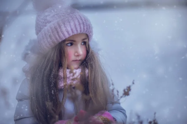 Beautiful girl with the romantic look in the Winter
