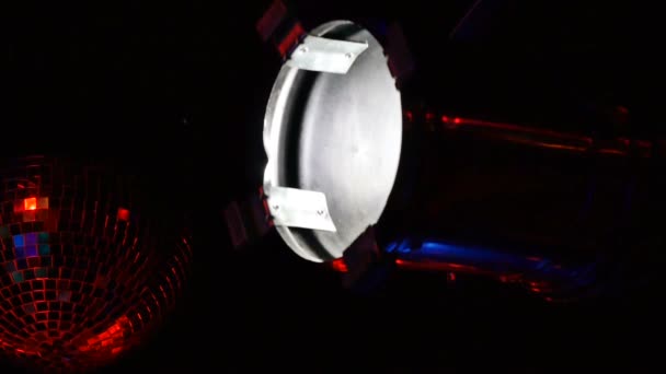 Fading LED spotlight for a nightclub in a glossy metal case in a nightclub room, close-up. — Stock Video