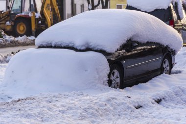 white snow covered car