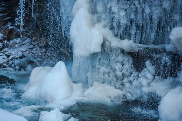 Frozen waterfall inside of the forest