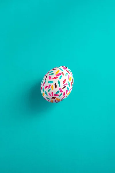 colorful easter egg, on electric blue background