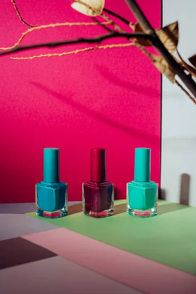 Set of different nail polish, on colorful background — Stock Photo, Image