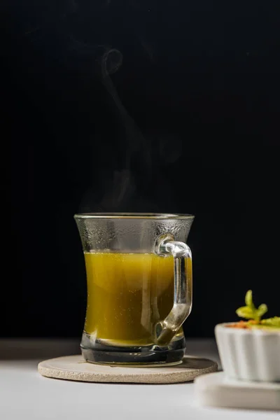 Hot matcha tea in transparent cups