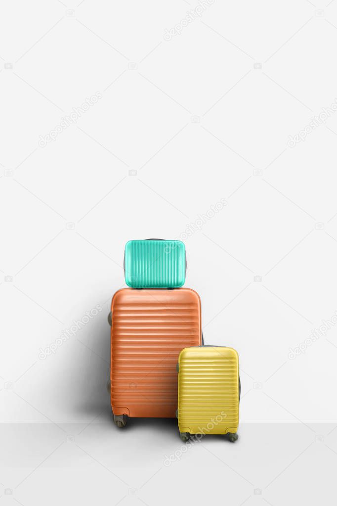 Colorful set of suitcases, minimal family travel concept.