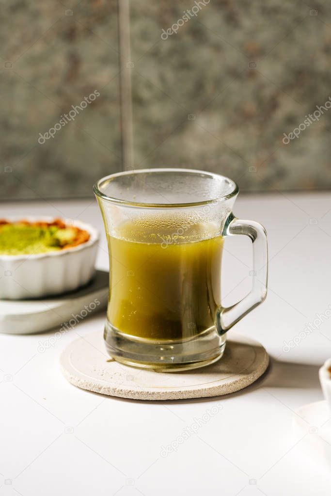 Hot matcha tea in transparent cups