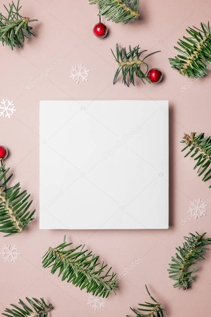  Blank card with fir tree branches red berries and star on pink 