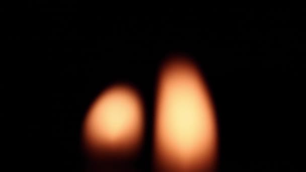 Close Blurred Burning Candle Flames Blinking Swaying Wind Night — Stock Video