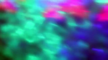Soyut renk arkaplanı. Bulanık döndüren renkli LED ışıkların, pürüzsüz video döngüsünün yakın plan görüntüsü.
