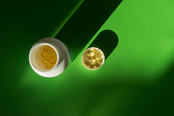 Close up of food supplement oil filled capsules suitable for: fish oil, omega 3, omega 6, omega 9, evening primrose, borage oil, flax seeds oil, vitamin A, vitamin D, vitamin D3, vitamin E