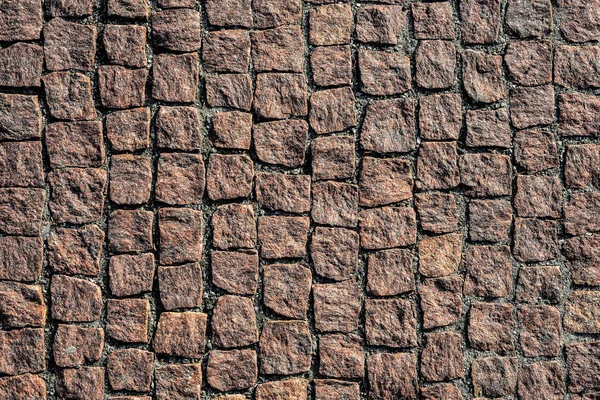 石道路平面図をクローズ アップ 花崗岩の古い舗装 茶色の正方形の石畳の歩道 モックアップやビンテージのグランジ テクスチャ — ストック写真